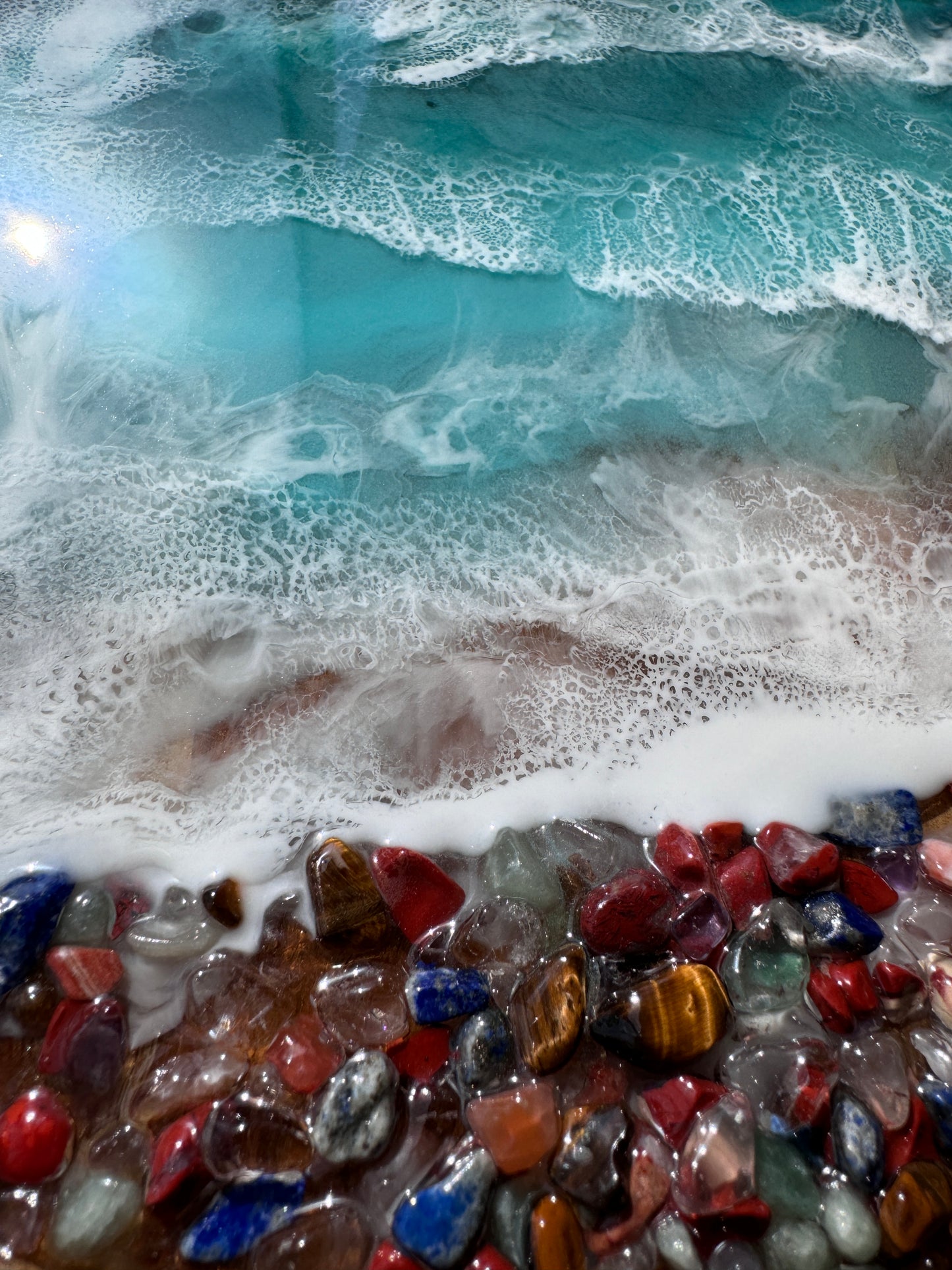 Resin ocean trinket tray with multicolored rocks