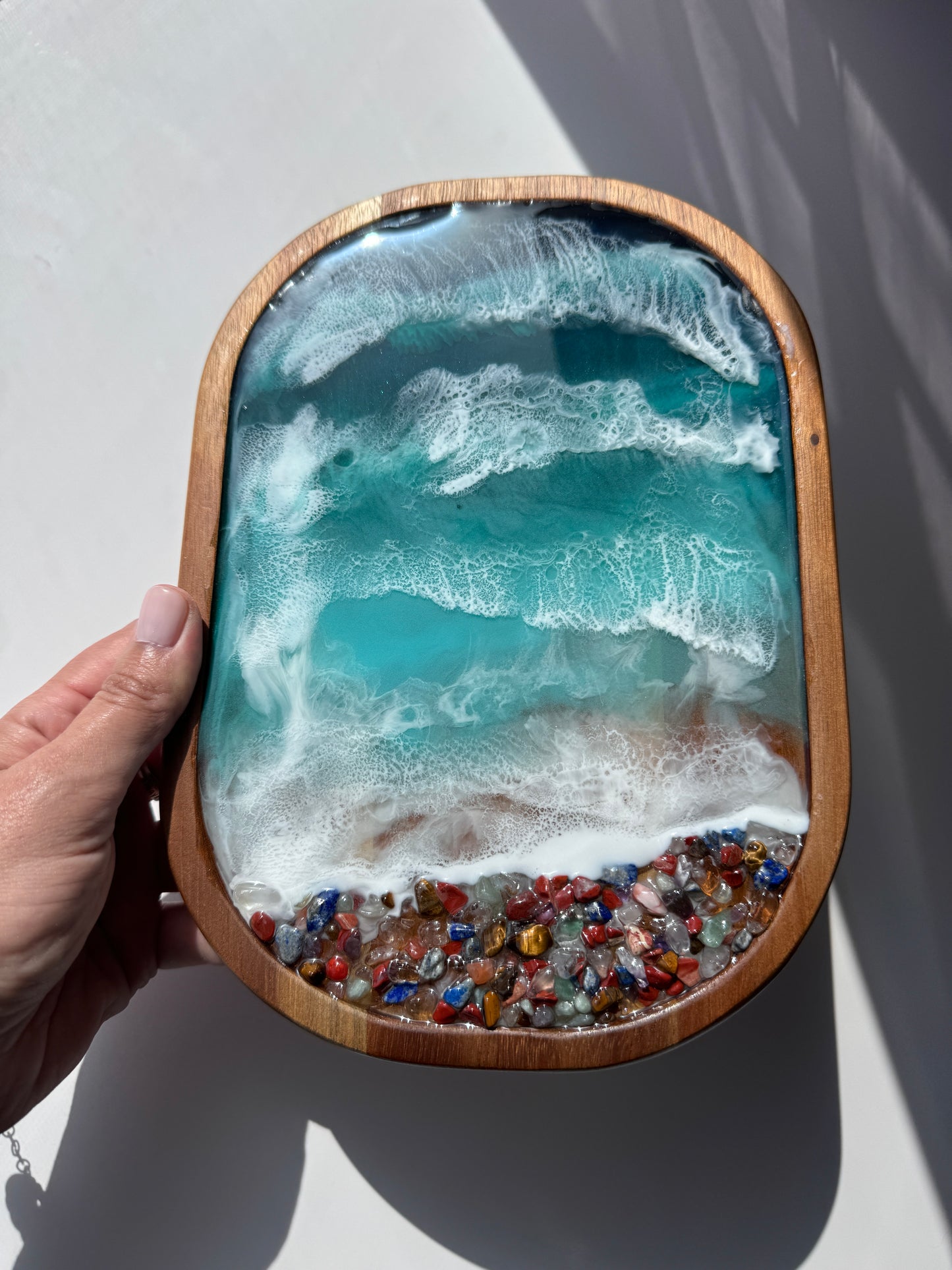 Resin ocean trinket tray with multicolored rocks