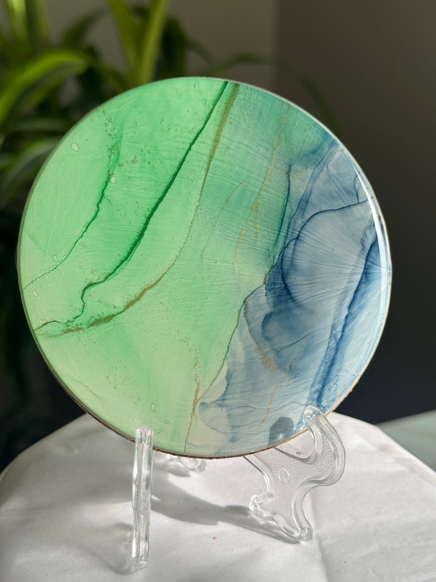 Blue and green alcohol ink coasters